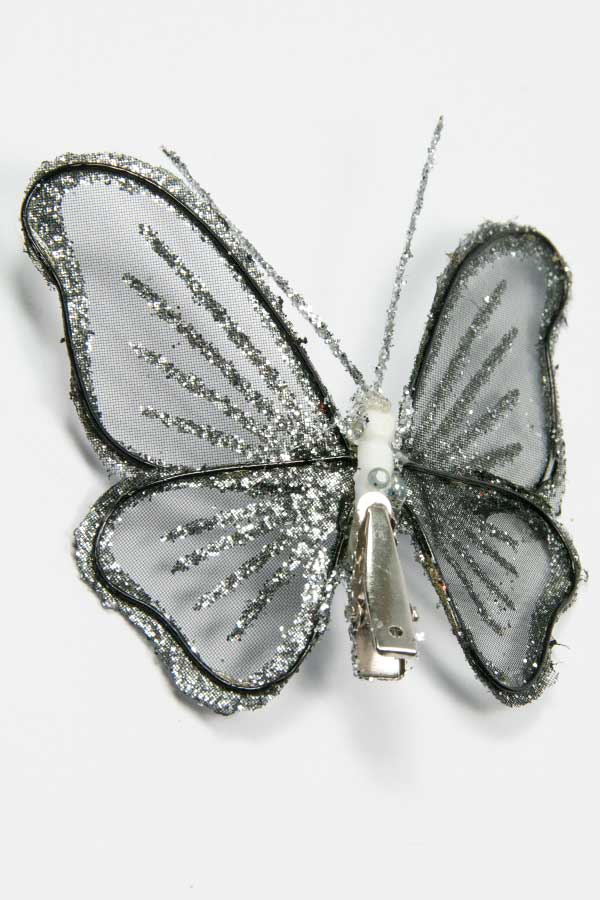 achterzijde van de zilverglitter vlinder met clip goed zichtbaar